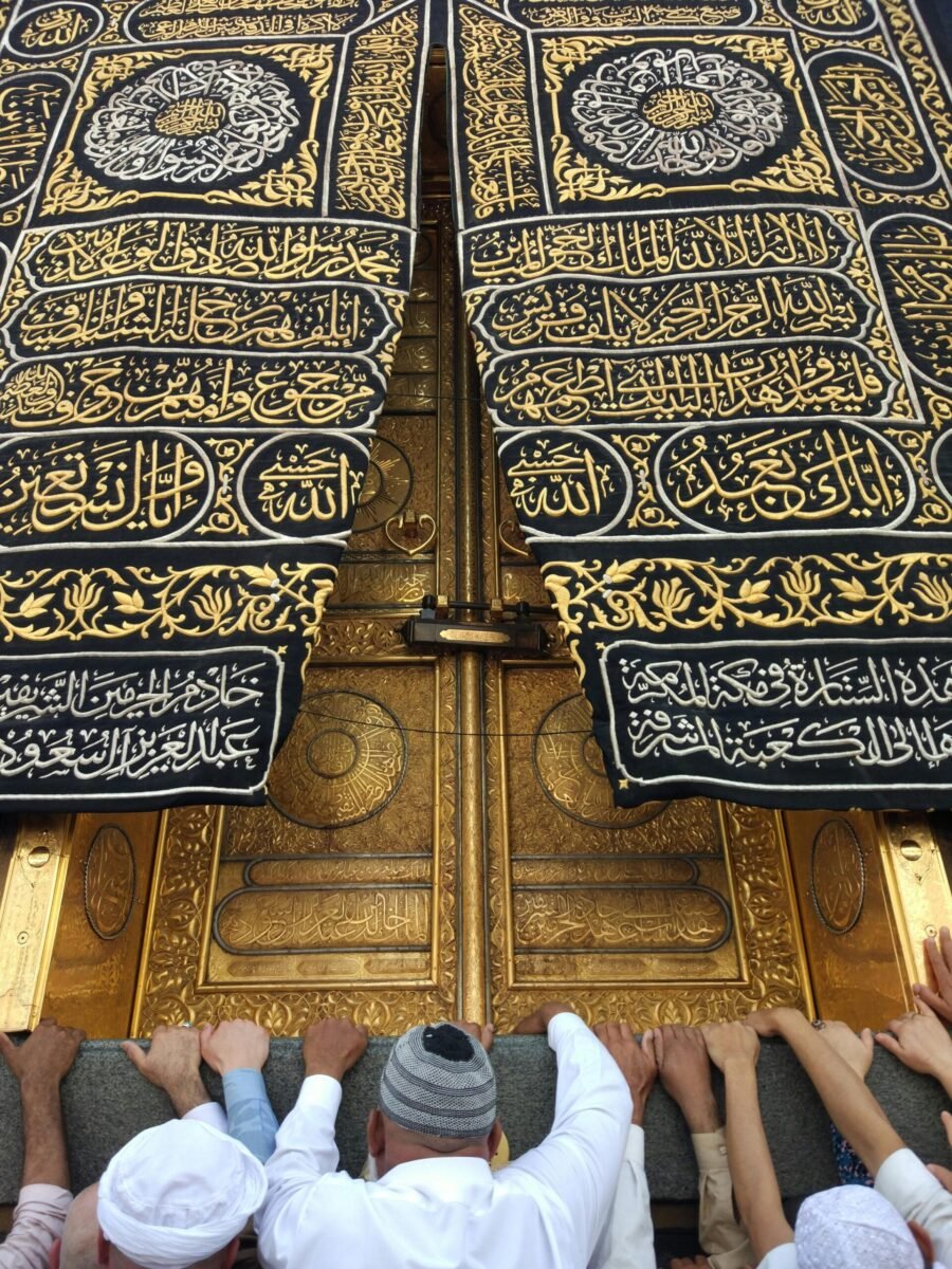Pilgrims gather at the ornate door of the Kaaba in Mecca, Saudi Arabia.
